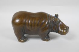 A filled bronze figure of a hippopotamus, 21cm long