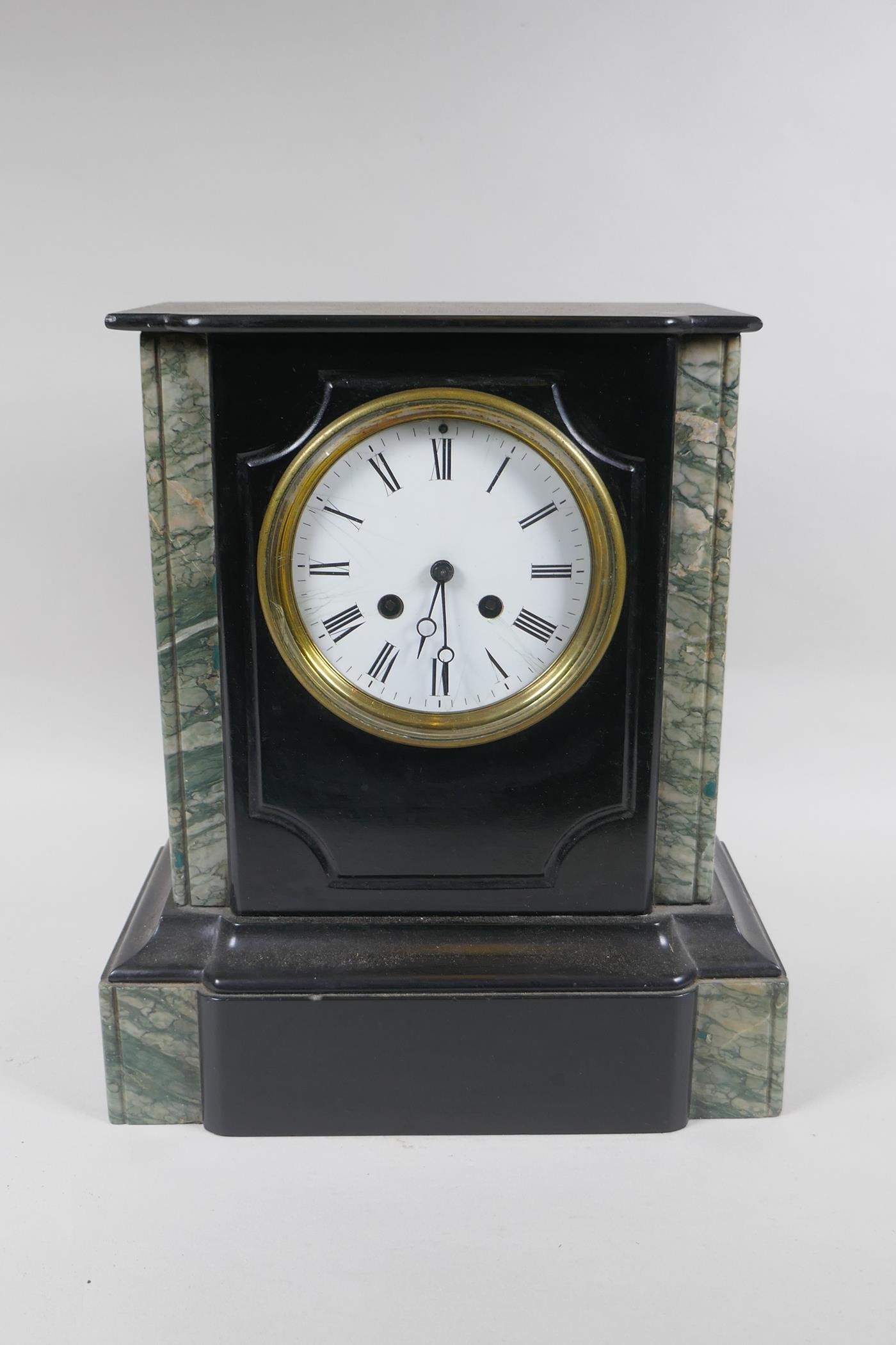 A late C19th French slate mantel clock, with an enamel dial and Roman numerals, the movement