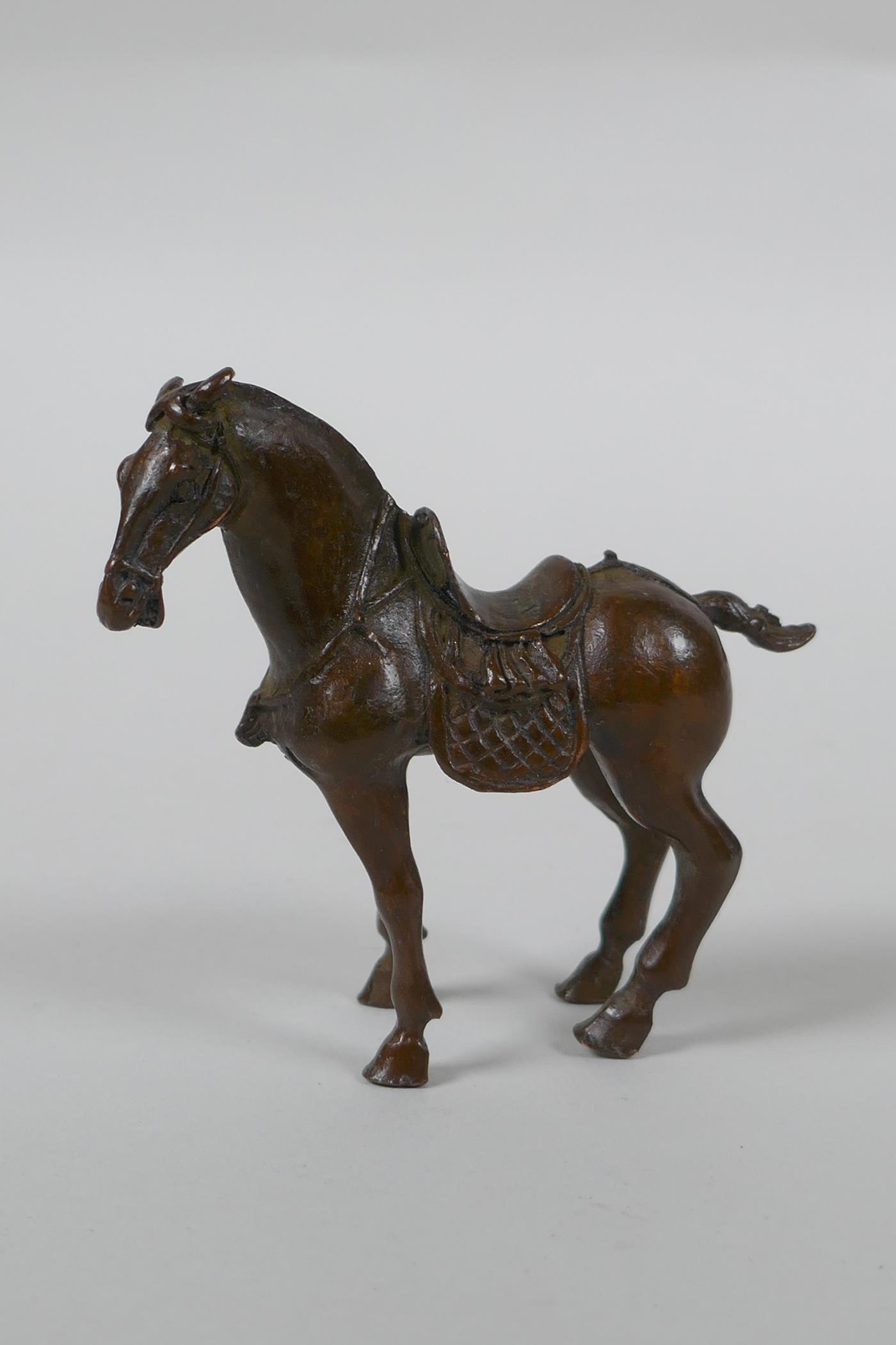 A Chinese bronze figure of a Tang style horse, 7cm high