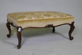 A C19th carved walnut stool with shaped frieze raised on cabriole supports with scroll feet, 82 x 50