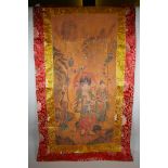 A Tibetan printed thangka with a silk mount, 110 x 65cm