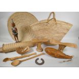 A quantity of Kenyan tribal items to include carved wood head rests, gourd flask, woven baskets etc