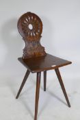 A C19th continental walnut hall chair with carved back, dated 1858 and initialled