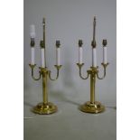 A pair of three branch brass table lamps, 63cm high