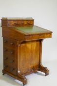 A Victorian inlaid figured walnut davenport, with pierced gallery over two drawers, one fitted