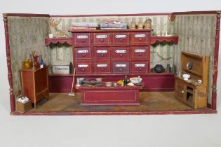 An antique model of a sweet shop, with opening drawers and counter, late C19th/early C20th, 62 x