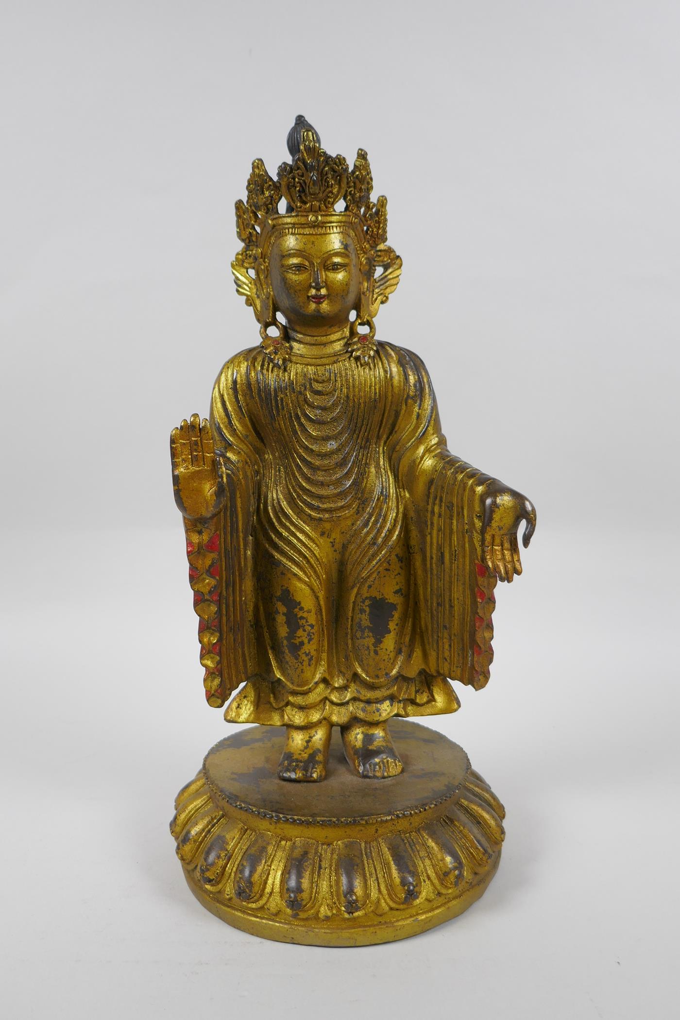 A Sino Tibetan gilt bronzed metal Buddha, 32cm high