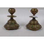 A pair of antique brass dwarf candlesticks, 13cm high