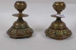 A pair of antique brass dwarf candlesticks, 13cm high