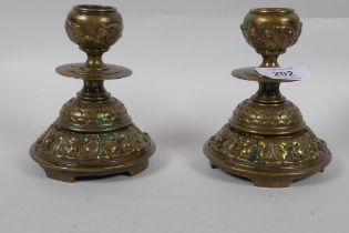 A pair of antique brass dwarf candlesticks, 13cm high