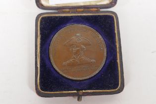 An 1897 Lord Nelson 'Foudroyant' flagship commemorative coin, struck in copper salvaged from the