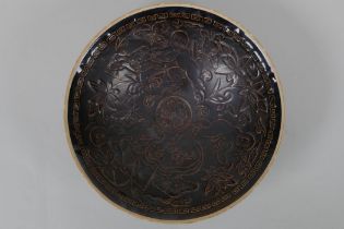 A Chinese Cizhou kiln porcelain dish with raised figural decoration, mark to base, 20cm diameter