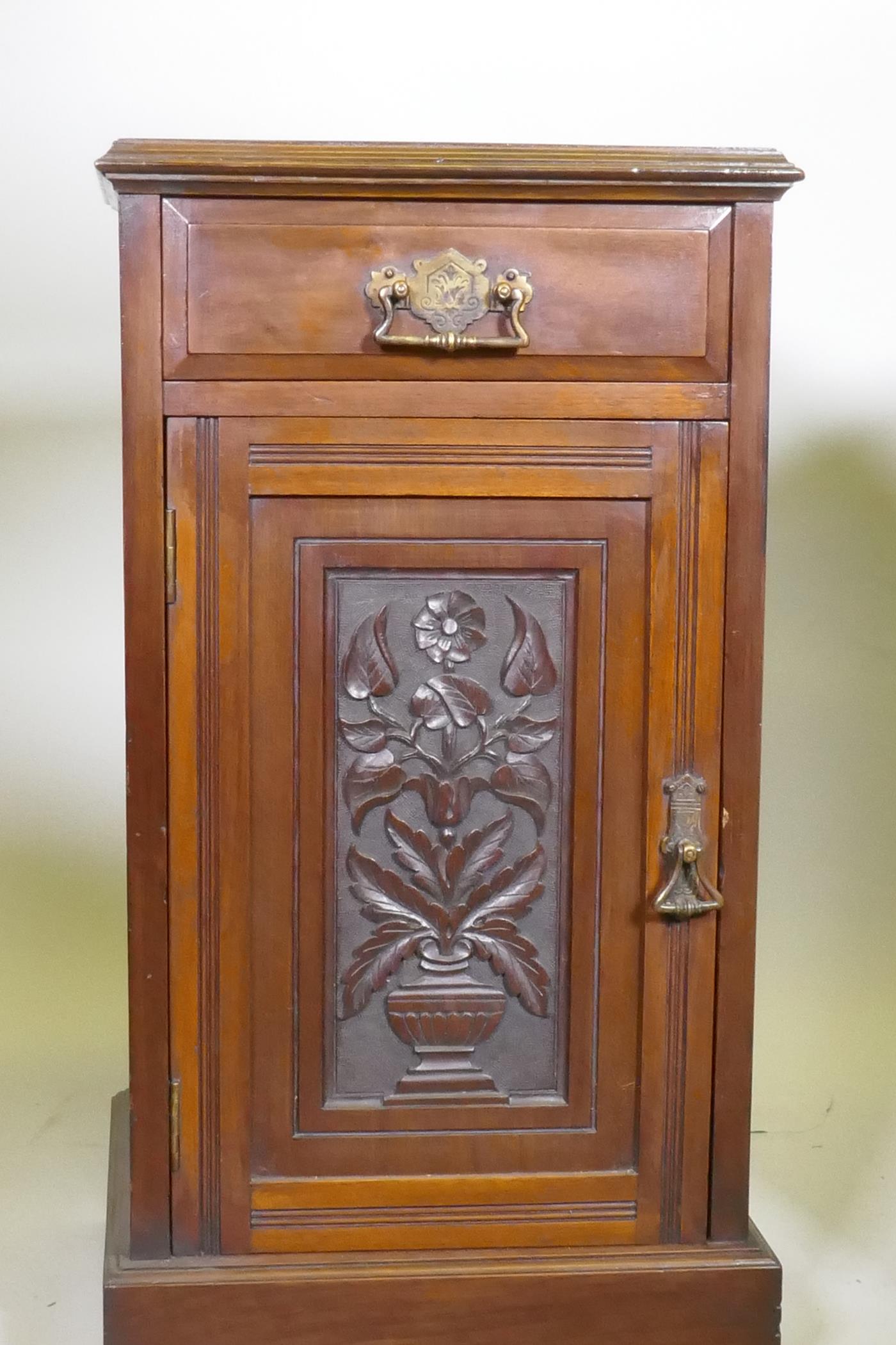 A pair of Victorian walnut bedside cabinets with single drawer over carved cupboard door, raised - Image 2 of 4