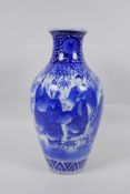 A Chinese blue and white porcelain vase decorated with sages in a bamboo forest, 30cm high