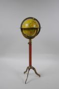 A brass desk top terrestrial globe, 40cm high