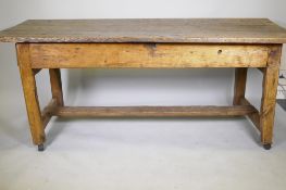 An C18th fruit wood refectory table with oak planked top and raised on square chamfered supports
