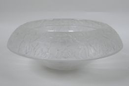 A vintage heavy glass ice bowl with a Greco-Roman decorative design to the rim, 27cm diameter