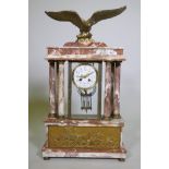 A C19th French rouge marble clock with bronze mounts, the case surmounted by an eagle signed L.