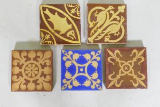 Three Minton encaustic tiles after Pugin, and two Chamberlain of Worcester tiles, 15 x 15cm