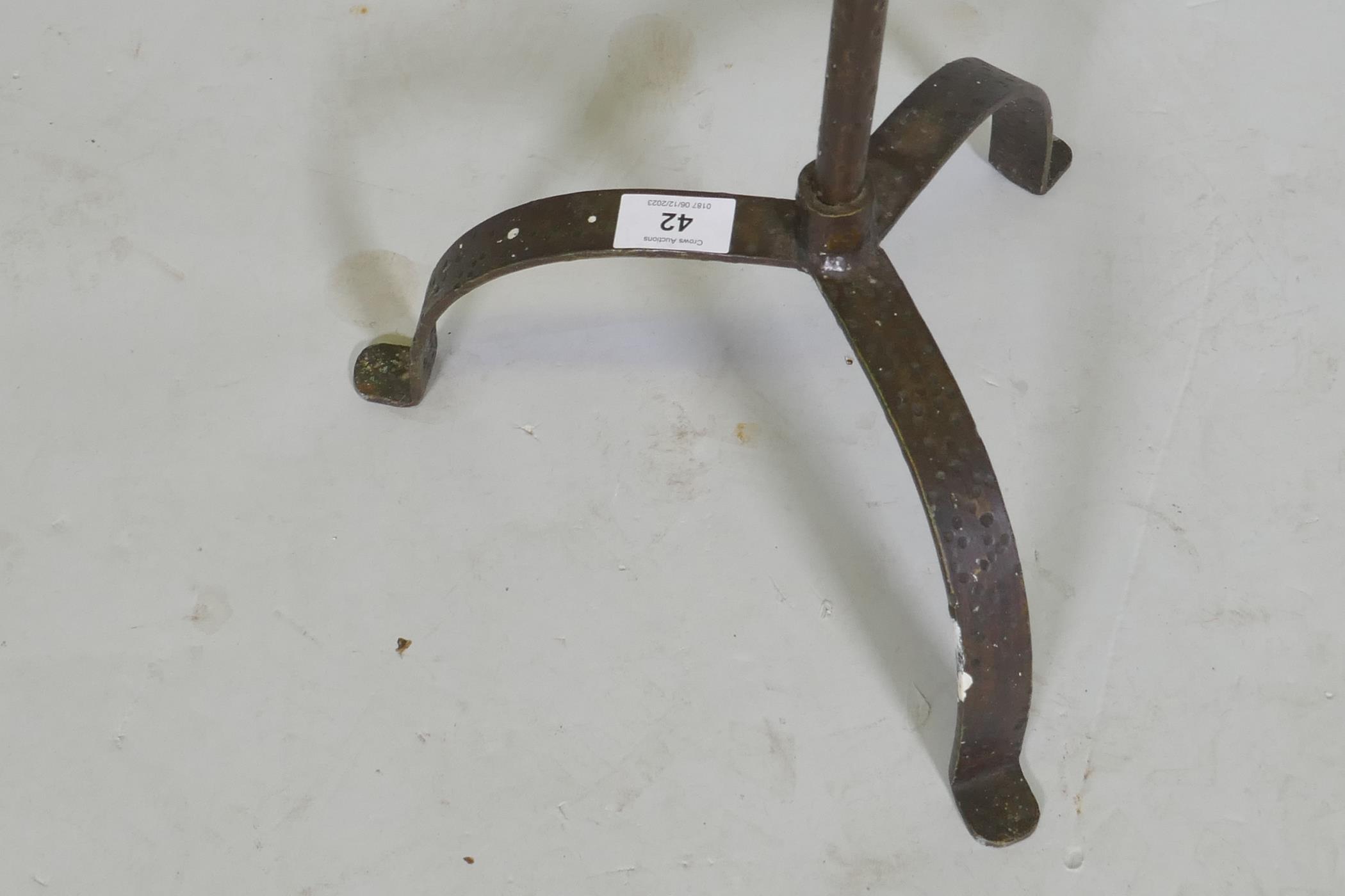 A wrought iron floor standing pricket candlestick on tripod supports, 128cm high - Image 2 of 3
