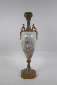 A C19th French ormolu and porcelain urn, decorated with a putto and lady, signed Daly, with