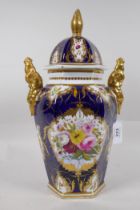 An antique continental porcelain jar and cover with gilt highlights and hand painted floral