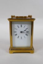 A brass cased carriage clock, the enamel dial with Roman numerals, 8 x 6cm, 11cm high