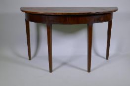 A C19th mahogany demi lune side table on square tapering supports, 122 x 46cm, 72cm high
