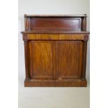 A C19th mahogany chiffonier, the top shelf with three quarter pierced brass gallery, over a base