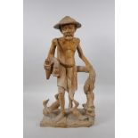 An oriental carved wood figure of a farmer surrounded by ducks, 46cm high
