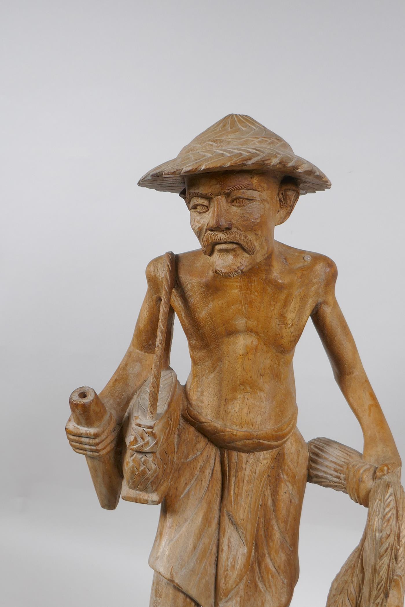 An oriental carved wood figure of a farmer surrounded by ducks, 46cm high - Image 2 of 5