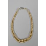 A vintage graduated pearl twin strand necklace, 38cm long