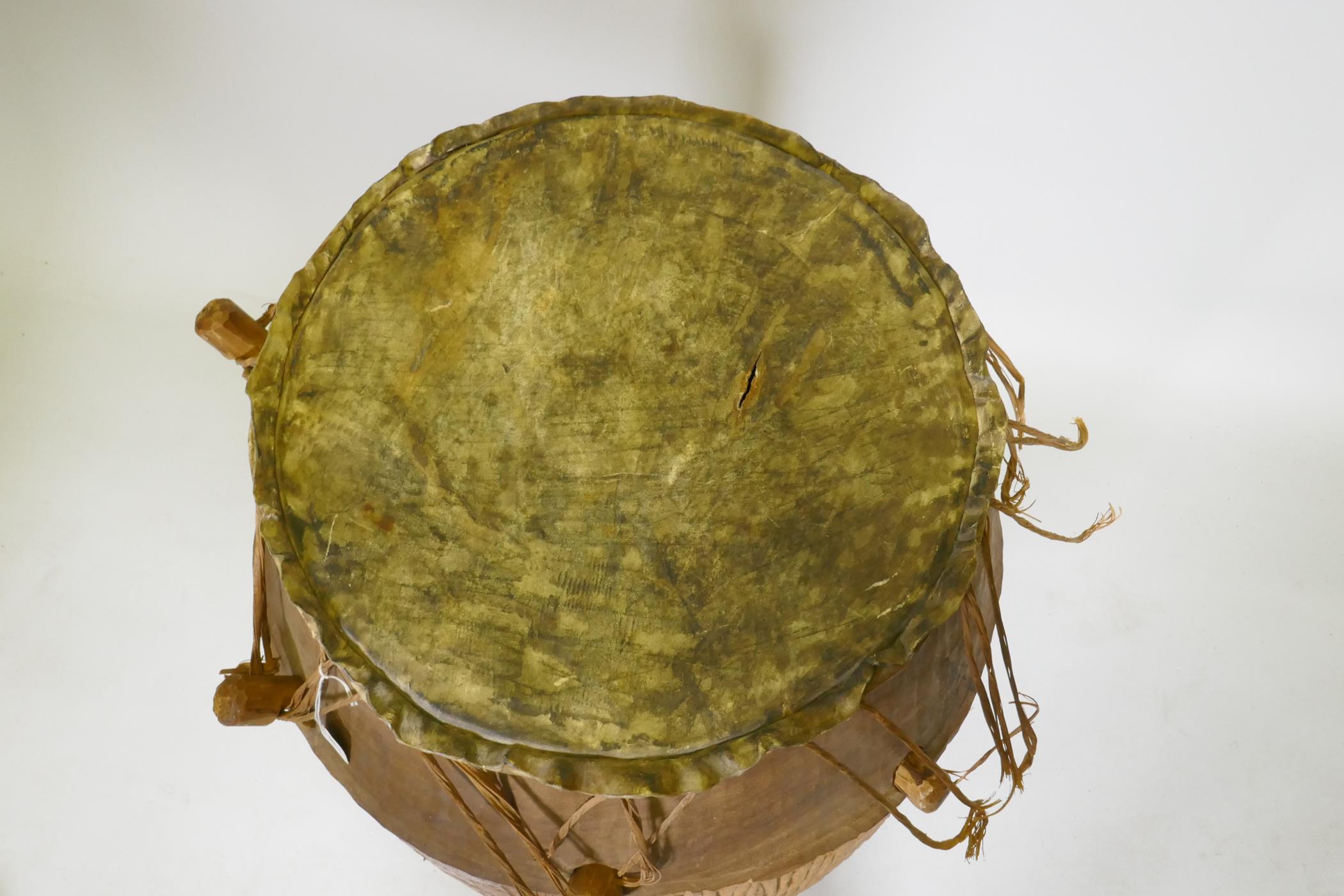 An African Ashanti tribe Atumpan talking drum, 87cm high, 46cm diameter - Image 3 of 3