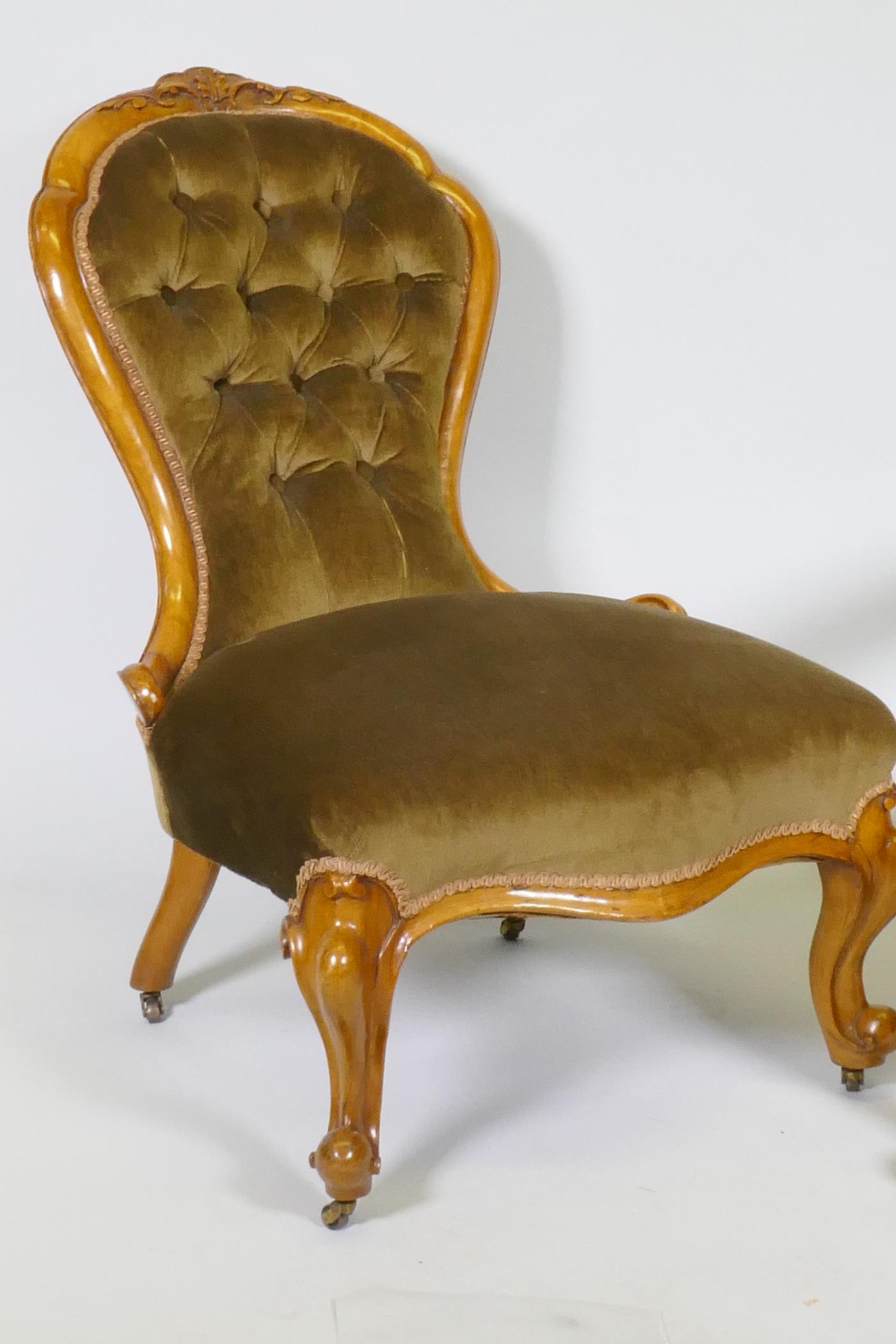 A Victorian gentleman's walnut show frame armchair with carved decoration, raised on cabriole - Image 3 of 3