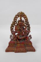 A Sino Tibetan copper lacquer bronze figure of a wrathful deity with remnants of gilt patina, 24cm