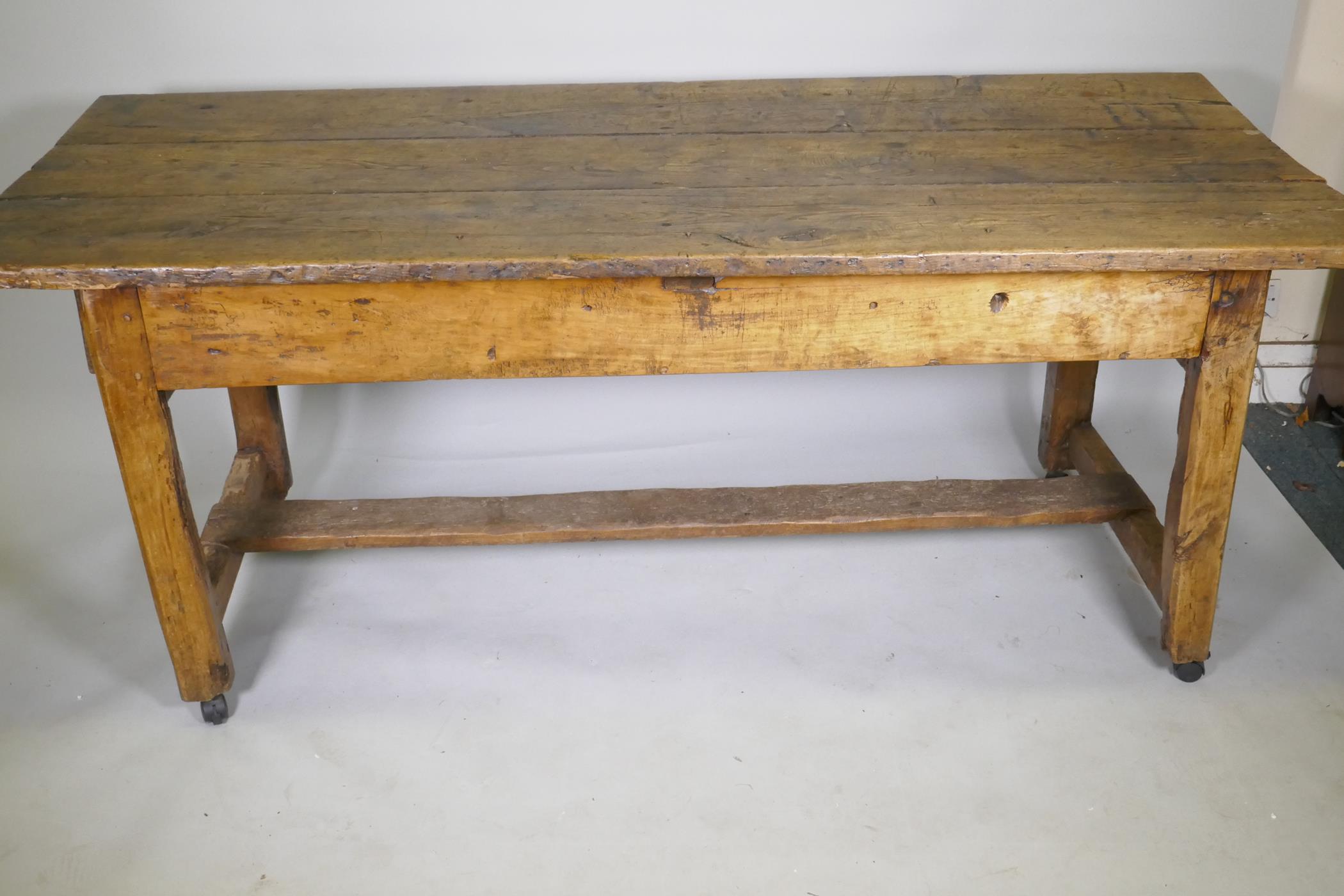 An C18th fruit wood refectory table with oak planked top and raised on square chamfered supports - Image 2 of 4