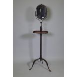 A C19th painted metal gentleman's shaving stand with tilt and swivel mirror and telescopic stand,