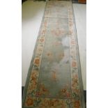 A Chinese wool runner, 86 x 317cm