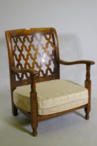 A small 1930s beechwood nursing / bedroom chair, with trellis back, 70cm high