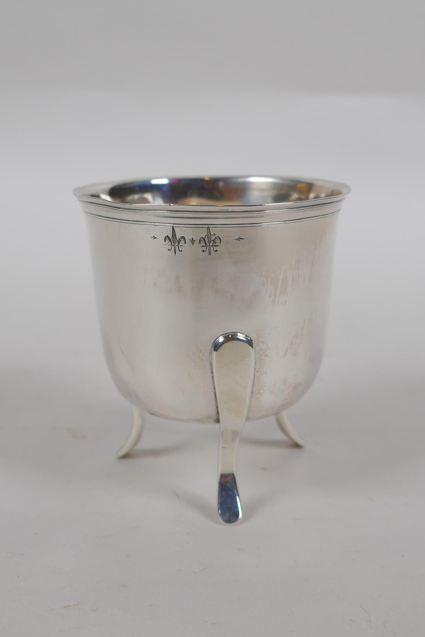 An antique continental silver pot raised on tripod supports, 80.8g, probably French