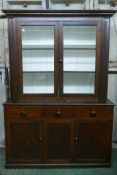 A C19th mahogany cabinet bookcase/dresser, the upper section with two glazed door, the lower with