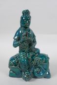 A Chinese teal glazed porcelain Guan Yin, mark to base, 21cm high