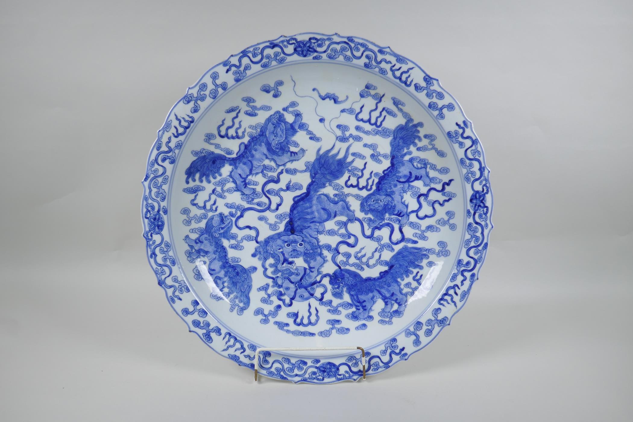 A blue and white porcelain charger with lobed rim and kylin decoration, Chinese KangXi 6 character