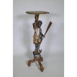 A Venetian polychrome and parcel gilt blackamoor stand in the form of a gondolier, 102cm high