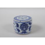 A Chinese blue and white porcelain drum shaped candlestick decorated with bats and auspicious