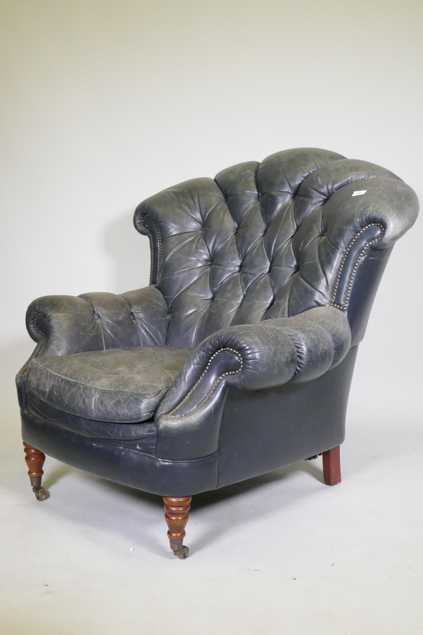 A Victorian style button back leather armchair, with scroll arms, fan back and studded detail, - Image 2 of 2