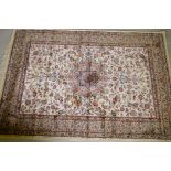 A Kashmiri ivory ground full pile rug with all over floral design, 117 x 170cm