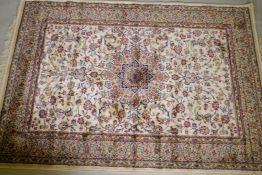 A Kashmiri ivory ground full pile rug with all over floral design, 117 x 170cm