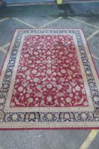 A good quality deep pile silk and wool carpet with Persian inspired design