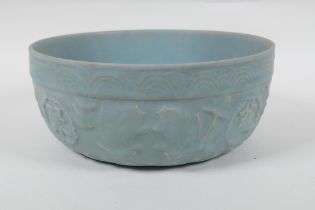 A Chinese Ru ware style bowl with raised character marks and carp decoration, 21cm diameter